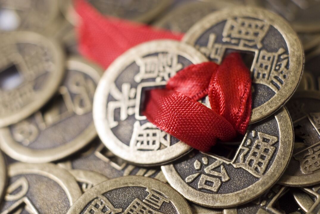 coins with red thread